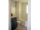 Well-lit bathroom with tile surround tub and shower, updated vanity, and neutral tiling at 15 Estrella Rd, Debary, FL 32713