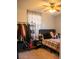 Cozy bedroom featuring a ceiling fan and a comfortable bed with stylish plaid bedding at 15 Estrella Rd, Debary, FL 32713