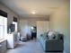 Relaxing living room with comfortable sofa, modern decor, and plenty of natural light at 15 Estrella Rd, Debary, FL 32713