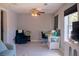 Bright home office with natural light, a ceiling fan, and a comfortable seating area at 15 Estrella Rd, Debary, FL 32713