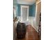 Stylish bathroom featuring a barrel sink, clawfoot tub, and hardwood floors at 209 E 4Th St, Sanford, FL 32771