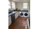 Well-lit kitchen features sleek appliances, white cabinetry, and ample counter space for food preparation at 209 E 4Th St, Sanford, FL 32771