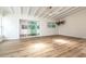 Spacious living room with hardwood floors, ceiling fan, and sliding doors to sunroom at 2637 Florence St, Orlando, FL 32818