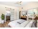 Bright bedroom with barn door to ensuite bathroom and mirrored closet at 2637 Florence St, Orlando, FL 32818