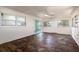 Bright sunroom with brick flooring, large windows, and access to backyard at 2637 Florence St, Orlando, FL 32818