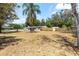 Spacious yard with a well-maintained lawn and mature trees, enhancing the property's appeal at 2637 Florence St, Orlando, FL 32818