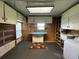 Functional workshop with ample storage, a workbench, and a utility sink at 3302 Wekiva Rd, Tavares, FL 32778