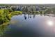 Breathtaking aerial view capturing a pier leading to a gazebo, set against the backdrop of a serene lake at 3480 Soho St # 107, Orlando, FL 32835
