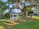 Charming community gazebo with a blue roof and beautiful surroundings, perfect for relaxing outdoors at 3480 Soho St # 107, Orlando, FL 32835