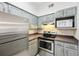 Updated kitchen with stainless steel appliances, and neutral paint, with great natural light at 3480 Soho St # 107, Orlando, FL 32835