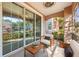 Inviting patio with comfortable seating area and sliding glass doors at 3480 Soho St # 107, Orlando, FL 32835
