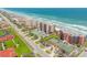 Beautiful aerial view of oceanfront condos with beach access and private tennis courts, offering convenience and luxury at 4139 S Atlantic Ave # B707, New Smyrna Beach, FL 32169