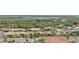 Discover a scenic neighborhood from above, showcasing cozy homes surrounded by lush trees and calm waters at 4139 S Atlantic Ave # B707, New Smyrna Beach, FL 32169