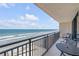 The spacious balcony features oceanfront views and comfortable seating, perfect for relaxation at 4139 S Atlantic Ave # B707, New Smyrna Beach, FL 32169