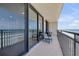 Relax on this balcony with ocean views and comfortable seating, perfect for enjoying the sea breeze at 4139 S Atlantic Ave # B707, New Smyrna Beach, FL 32169