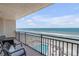 Enjoy breathtaking ocean views from this spacious balcony with stylish outdoor furniture at 4139 S Atlantic Ave # B707, New Smyrna Beach, FL 32169