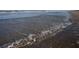 Gentle waves lapping onto a sandy beach, creating a peaceful coastal scene at 4139 S Atlantic Ave # B707, New Smyrna Beach, FL 32169