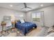 Bright bedroom with a queen bed, desk, large window, and recessed lighting at 4139 S Atlantic Ave # B707, New Smyrna Beach, FL 32169