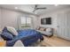 Comfortable bedroom showcasing a full bed, futon, and scenic views from the window at 4139 S Atlantic Ave # B707, New Smyrna Beach, FL 32169