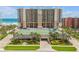 View of building showing tennis court and underground parking at 4139 S Atlantic Ave # B707, New Smyrna Beach, FL 32169
