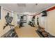 Functional gym featuring cardio machines and motivational wall art for an inspiring workout space at 4139 S Atlantic Ave # B707, New Smyrna Beach, FL 32169