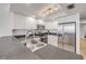 Bright kitchen features stainless steel appliances and white cabinets at 4139 S Atlantic Ave # B707, New Smyrna Beach, FL 32169