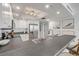 Bright kitchen features stainless steel appliances and white cabinets at 4139 S Atlantic Ave # B707, New Smyrna Beach, FL 32169