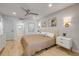 Bright bedroom with stylish decor and access to the bathroom and hallway, creating a welcoming space at 4139 S Atlantic Ave # B707, New Smyrna Beach, FL 32169