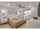 Comfortable bedroom with a ceiling fan and ample natural light, offering a relaxing retreat at 4139 S Atlantic Ave # B707, New Smyrna Beach, FL 32169