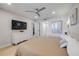 Cozy bedroom with modern furnishings and access to a hallway, closet and bathroom at 4139 S Atlantic Ave # B707, New Smyrna Beach, FL 32169