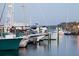 Marina with multiple boats docked, offering a scenic waterfront experience at 4139 S Atlantic Ave # B707, New Smyrna Beach, FL 32169