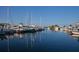 Waterfront marina featuring various boats docked in tranquil waters, offering a serene coastal setting at 4139 S Atlantic Ave # B707, New Smyrna Beach, FL 32169