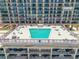 Inviting rooftop pool surrounded by seating, offering a luxurious and relaxing amenity at 4139 S Atlantic Ave # B707, New Smyrna Beach, FL 32169