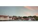 Scenic waterfront view showcasing a bridge, restaurant, and serene water under a beautiful sky at 4139 S Atlantic Ave # B707, New Smyrna Beach, FL 32169