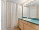 Bright bathroom with a shower-tub combo and plenty of space for storage at 4306 Pebblestone Ct, Orlando, FL 32826