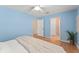 This bedroom offers natural light, a ceiling fan, and a view of the backyard at 4306 Pebblestone Ct, Orlando, FL 32826
