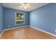 Bright bedroom with a large window and nice laminate flooring at 4306 Pebblestone Ct, Orlando, FL 32826