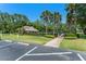 The community clubhouse with palm trees, parking, and a welcoming entrance at 4306 Pebblestone Ct, Orlando, FL 32826