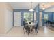 Bright dining area featuring an adjacent doorway, a round table, and a window at 4306 Pebblestone Ct, Orlando, FL 32826