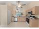 Well-lit kitchen with stainless steel appliances, light wood cabinets, and a view into other rooms at 4306 Pebblestone Ct, Orlando, FL 32826