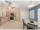 Spacious kitchen featuring a breakfast nook, light wood cabinets, and modern appliances at 4306 Pebblestone Ct, Orlando, FL 32826
