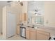 Bright kitchen featuring wood cabinets, stainless steel appliances, and an open layout at 4306 Pebblestone Ct, Orlando, FL 32826