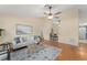 Inviting living room with a comfortable couch, a stylish coffee table, and hardwood floors at 4306 Pebblestone Ct, Orlando, FL 32826