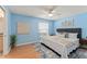 Relaxing bedroom with a plush bed, neutral colors, and ample natural light at 4306 Pebblestone Ct, Orlando, FL 32826