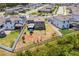Aerial view of a well-maintained home with a spacious backyard and covered patio in a desirable suburban neighborhood at 5637 Beggs Road, St Cloud, FL 34771
