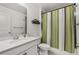 Comfortable bathroom featuring a vanity, toilet, a walk-in shower, and neutral colors at 5637 Beggs Road, St Cloud, FL 34771