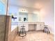 Bright bathroom with a double vanity, a large mirror, and stylish tile flooring at 5637 Beggs Road, St Cloud, FL 34771