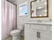Cozy bathroom with shower and tub combination, a vanity, and a mirror with lights at 5637 Beggs Road, St Cloud, FL 34771