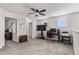 Bright bonus room featuring neutral walls, ceiling fan, carpet floors, and a functional computer setup at 5637 Beggs Road, St Cloud, FL 34771