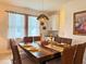 Cozy dining room with a modern chandelier, perfect for Gathering meals at 5637 Beggs Road, St Cloud, FL 34771